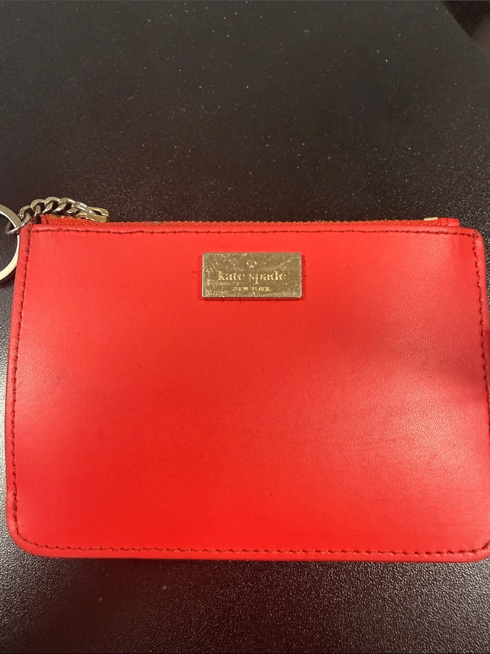 kate spade red leather pouch with gold-tone logo and key ring